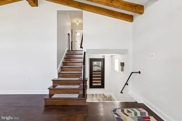a view of entryway with wooden floor