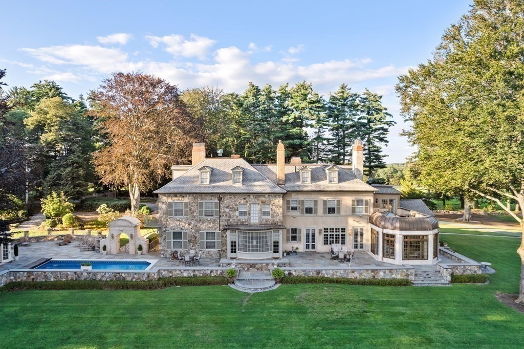 59 Walnut Road Wenham, MA 01984 - Photo 27 of 39 a front view of a house with a yard table and chairs