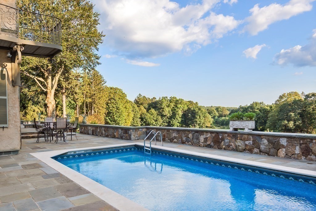 59 Walnut Road Wenham, MA 01984 - Photo 33 of 39 a view of swimming pool with seating space and trees in the background