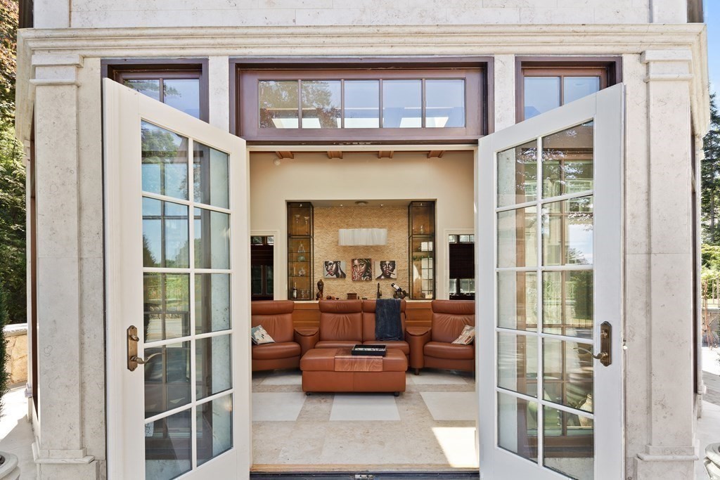 59 Walnut Road Wenham, MA 01984 - Photo 34 of 39 a balcony with furniture and a fireplace