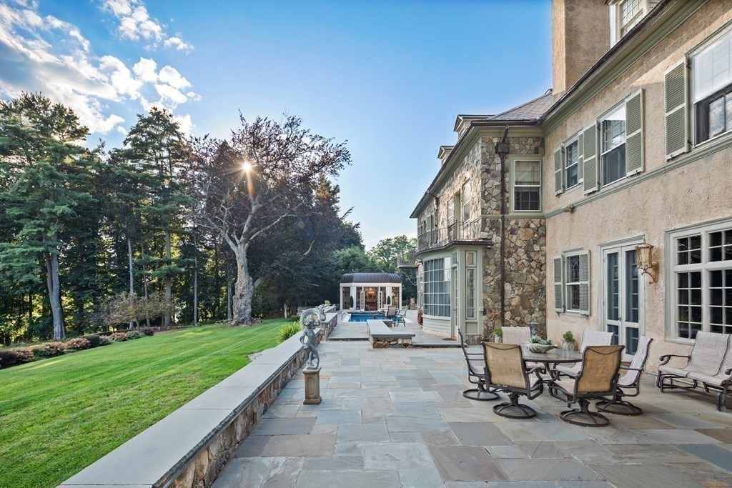 59 Walnut Road Wenham, MA 01984 - Photo 37 of 39 a view of a patio with a table and chairs