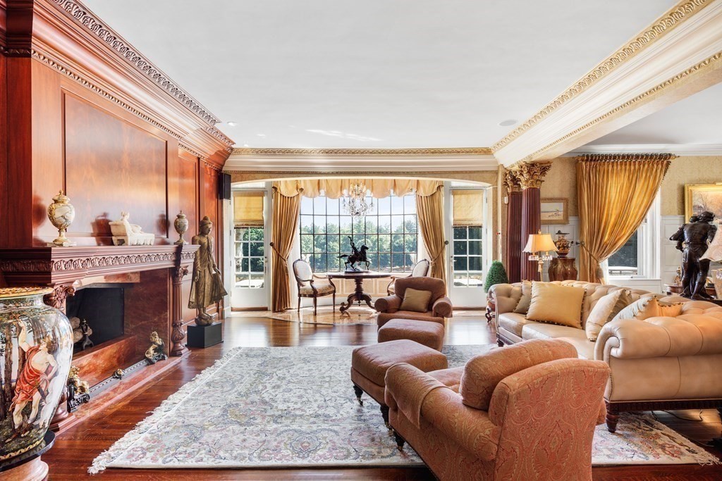 59 Walnut Road Wenham, MA 01984 - Photo 9 of 39 a living room with furniture fireplace and a large window