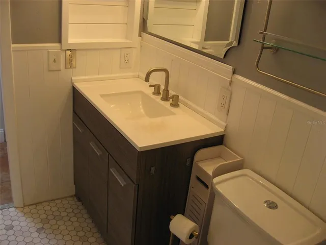 a view of a garden with an outdoor seating