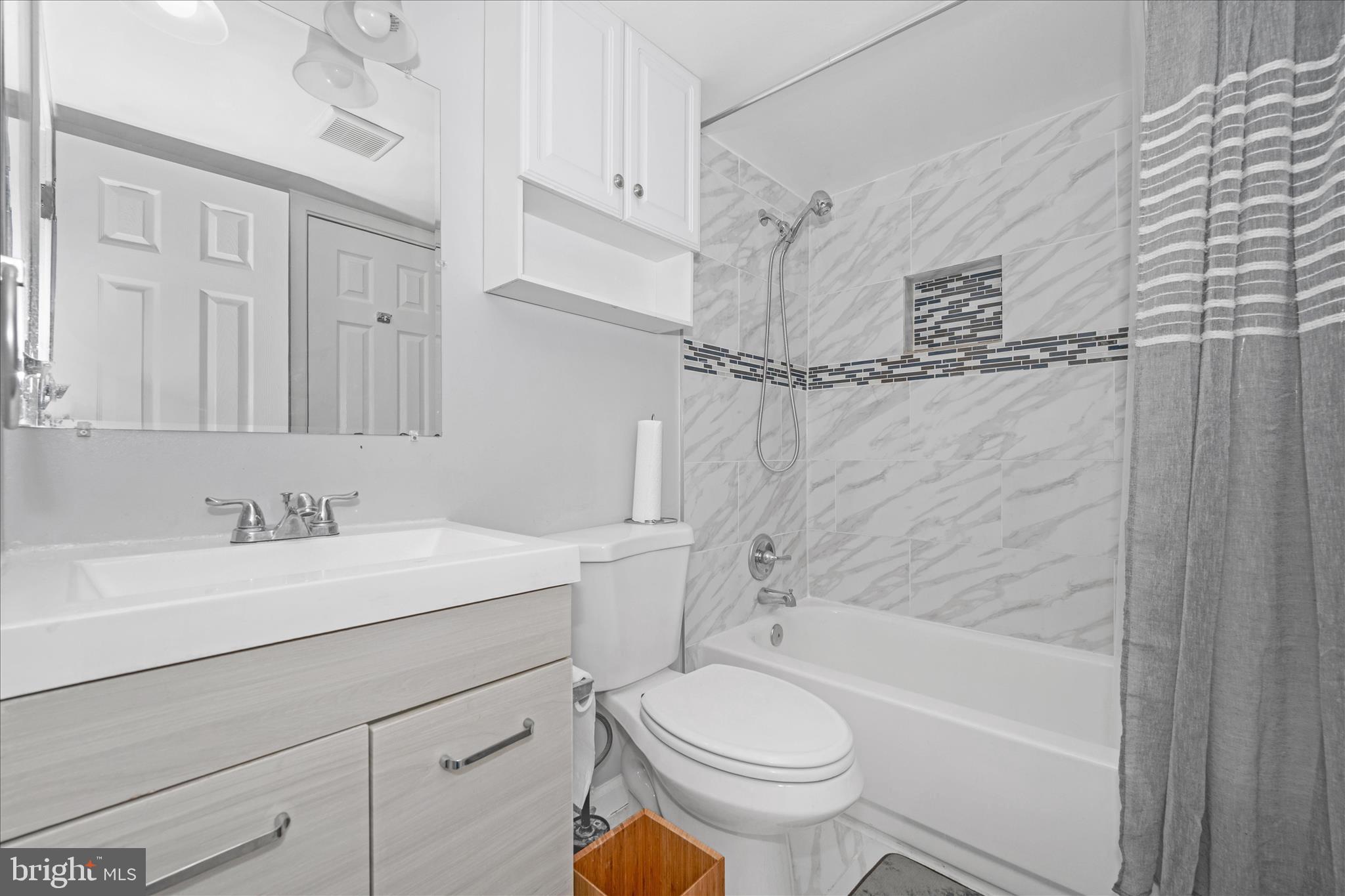 330 Heather Ridge Drive Frederick, MD 21702 - Photo 20 of 39 a bathroom with a sink toilet vanity and shower