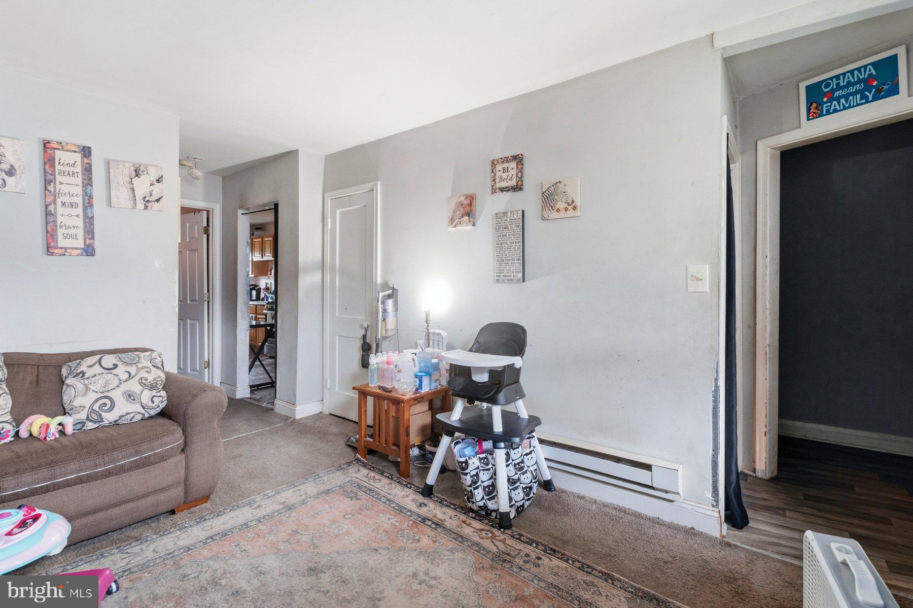 4931 Brookwood Road Baltimore, MD 21225 - Photo 5 of 25 a living room with furniture and a window