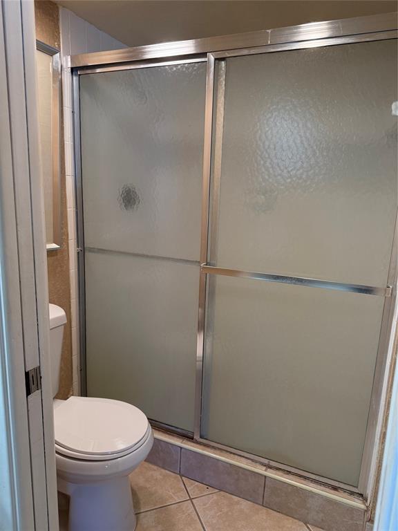 2302 Bridgewood Drive, Unit 2302 Boca Raton, FL 33434 - Photo 16 of 20 a bathroom with a shower and a toilet