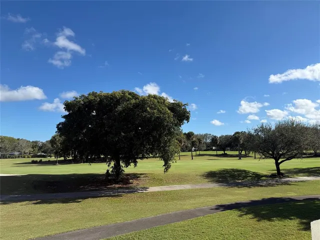 a view of a chairs and table on the deck