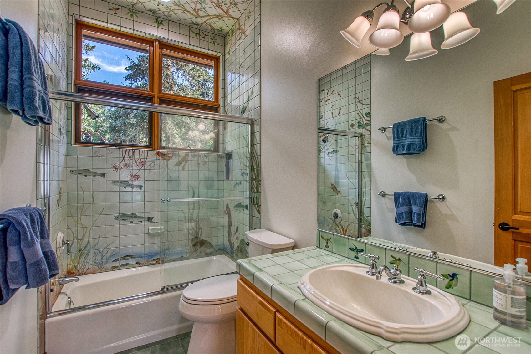 285 Raptor Road Orcas Island, WA 98245 - Photo 21 of 40 a bathroom with a sink a toilet a mirror and shower