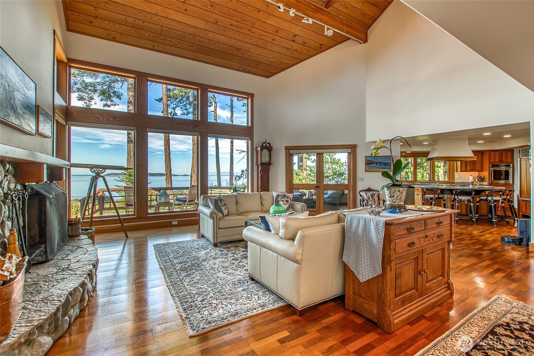 285 Raptor Road Orcas Island, WA 98245 - Photo 6 of 40 a living room with fireplace furniture and a rug