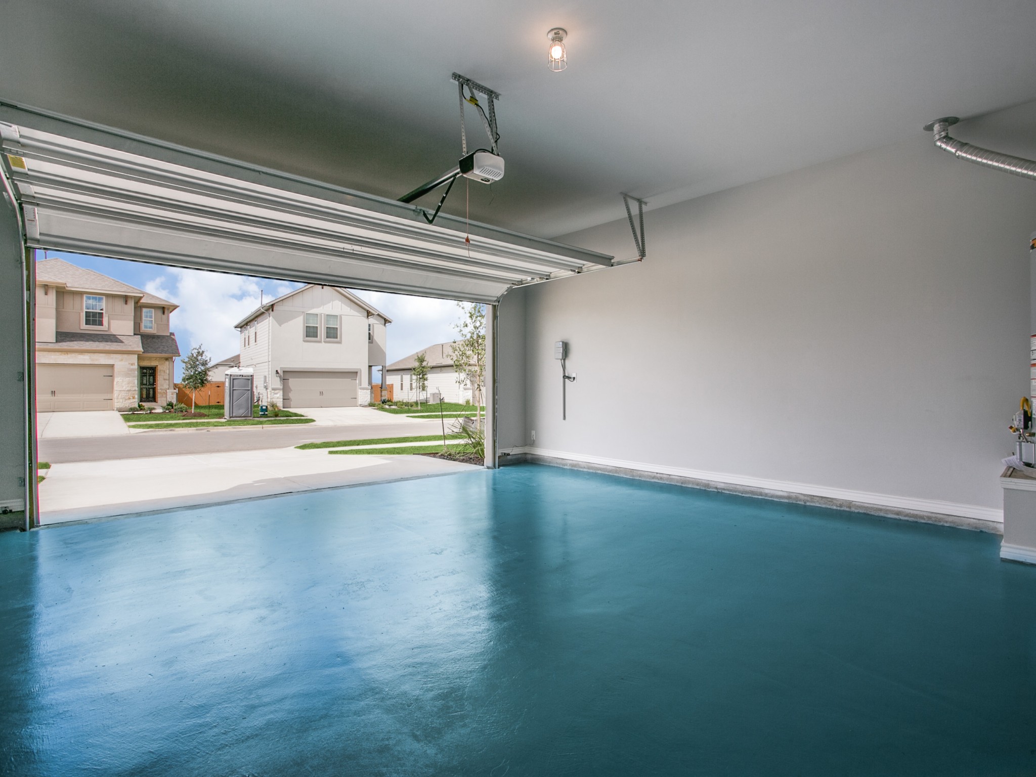 508 Rearing Mare Pass Georgetown, TX 78626 - Photo 19 of 26 Garage featuring a garage door opener and baseboards