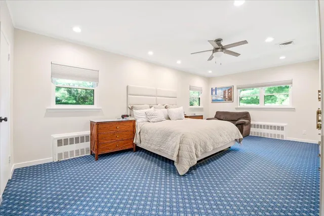 a bedroom with a bed and window