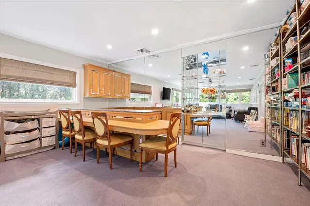 a room with lots of furniture and a flat screen tv