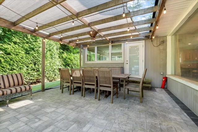 a view of a dining room with furniture window and outside view