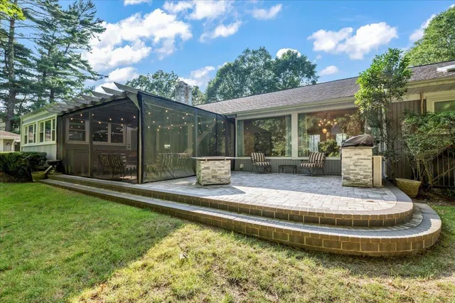 a view of a house with backyard porch and furniture