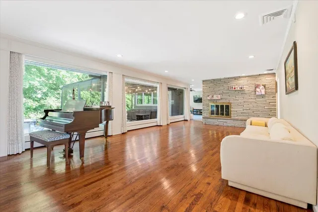 a living room with furniture and a large window