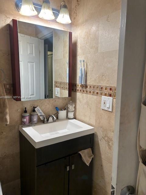 13904 Southwest 65th Terrace, Unit 8 Miami, FL 33183 - Photo 17 of 24 a bathroom with a sink and a mirror