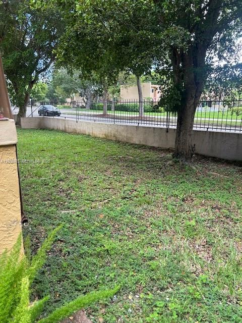 13904 Southwest 65th Terrace, Unit 8 Miami, FL 33183 - Photo 22 of 24 a view of outdoor space with trees all around