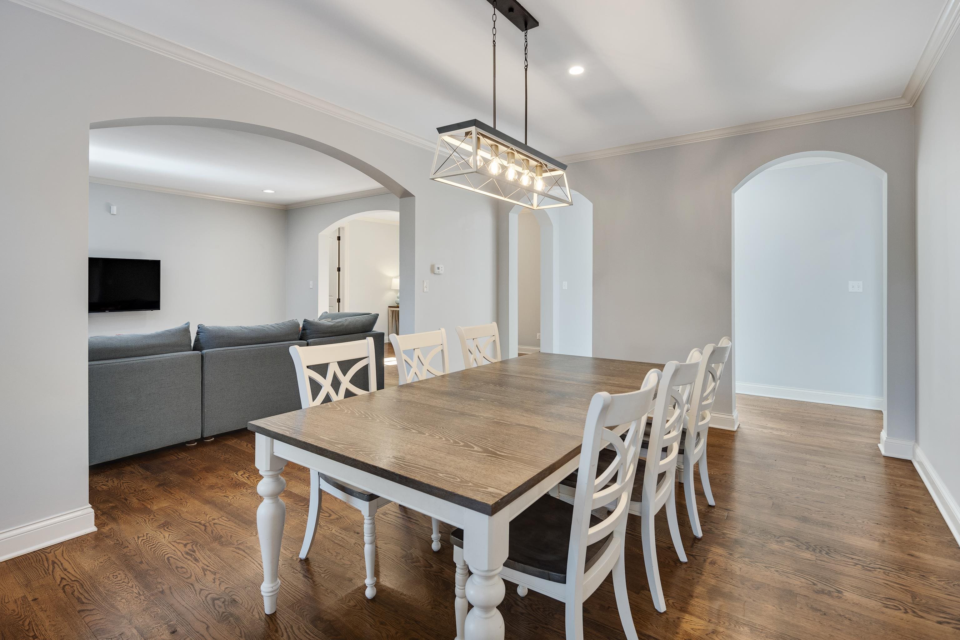 237 Windover Road Memphis, TN 38111 - Photo 14 of 37 Dining space with crown molding, dark wood-style flooring, and recessed lighting