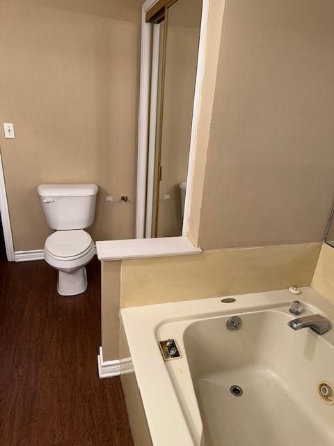1516 Blackjack Road West Aubrey, TX 76227 - Photo 12 of 27 a bathroom with a bathtub and toilet