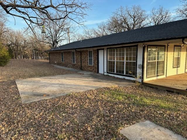 1516 Blackjack Road West Aubrey, TX 76227 - Photo 24 of 27 a house with trees in the background