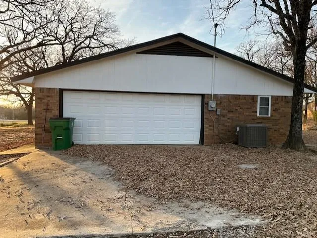 a backyard of a house with garage
