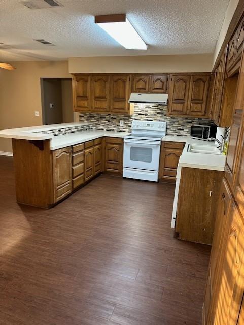 1516 Blackjack Road West Aubrey, TX 76227 - Photo 7 of 27 a large kitchen with stainless steel appliances a stove a sink dishwasher and a oven