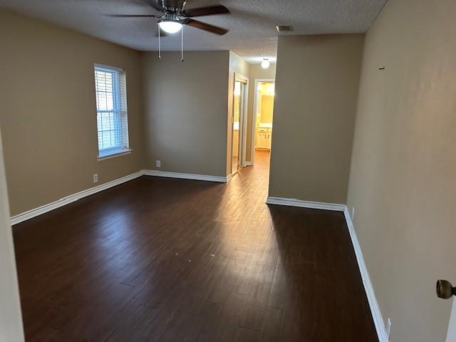 1516 Blackjack Road West Aubrey, TX 76227 - Photo 9 of 27 an empty room with wooden floor and windows