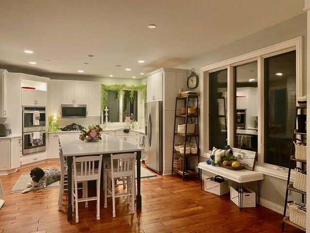 9261 Ruth Court St. John, IN 46373 - Photo 9 of 48 a view of a dining room with furniture and wooden floor