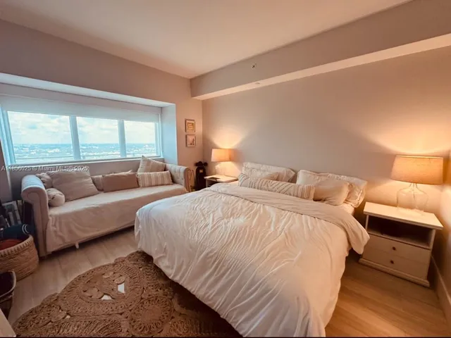 a bedroom with a bed and a couch