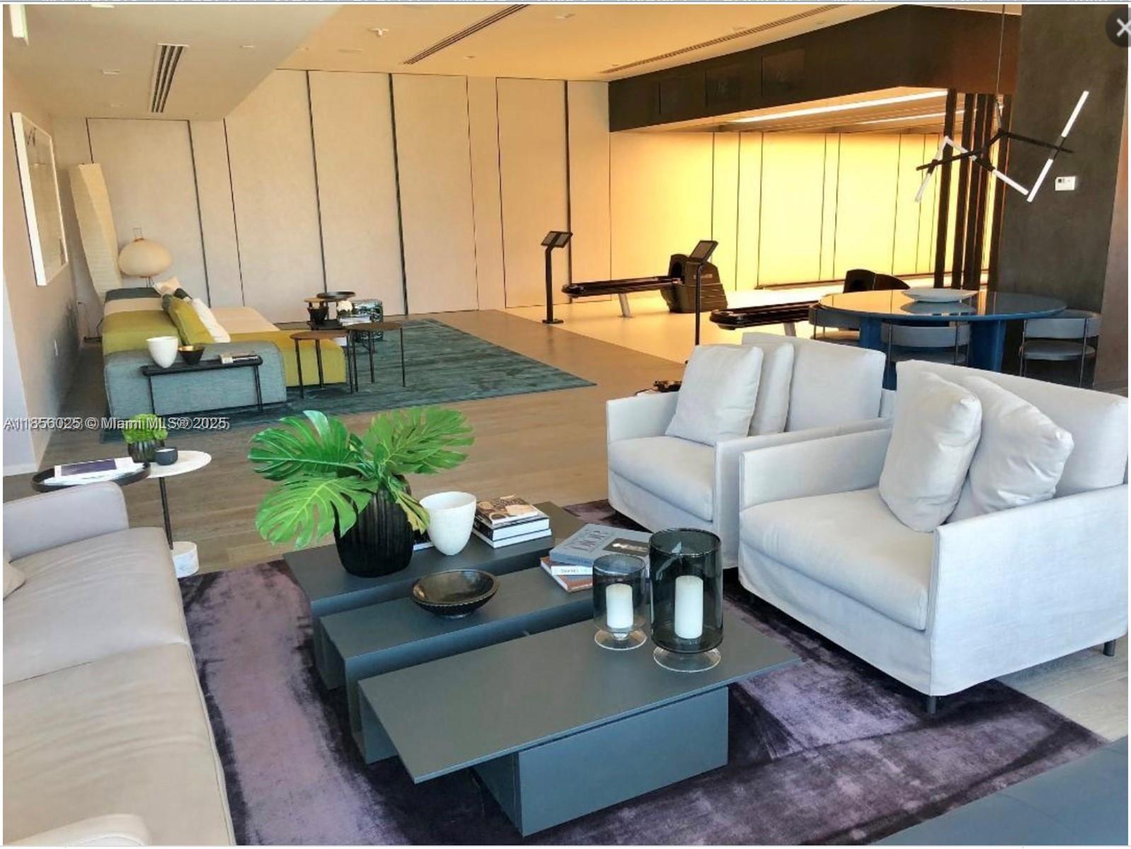 650 Northeast 32nd Street, Unit 4003 Miami, FL 33137 - Photo 22 of 32 a living room with furniture large window and a table