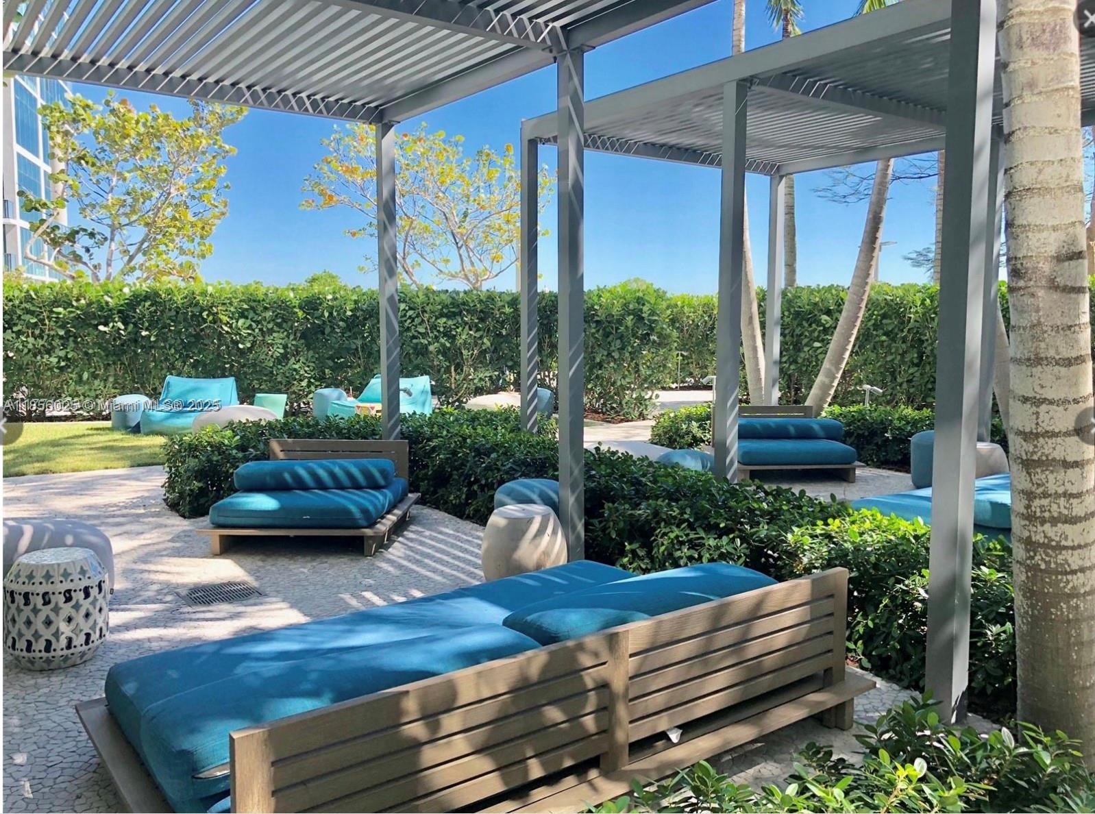 650 Northeast 32nd Street, Unit 4003 Miami, FL 33137 - Photo 28 of 32 a view of a couches in patio with a yard