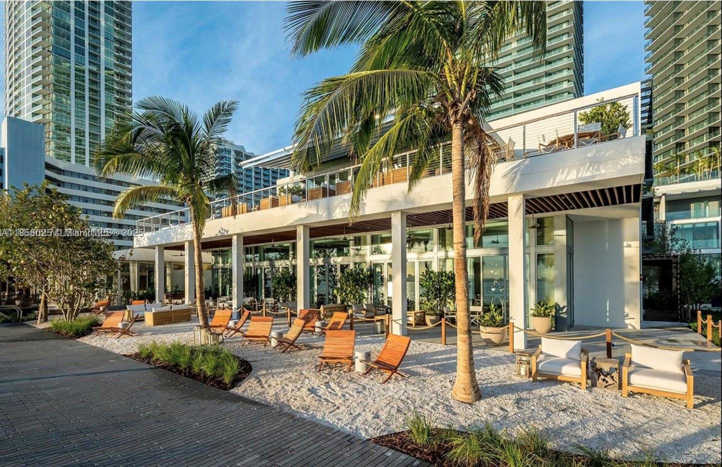 650 Northeast 32nd Street, Unit 4003 Miami, FL 33137 - Photo 29 of 32 a view of a building with sitting area and porch