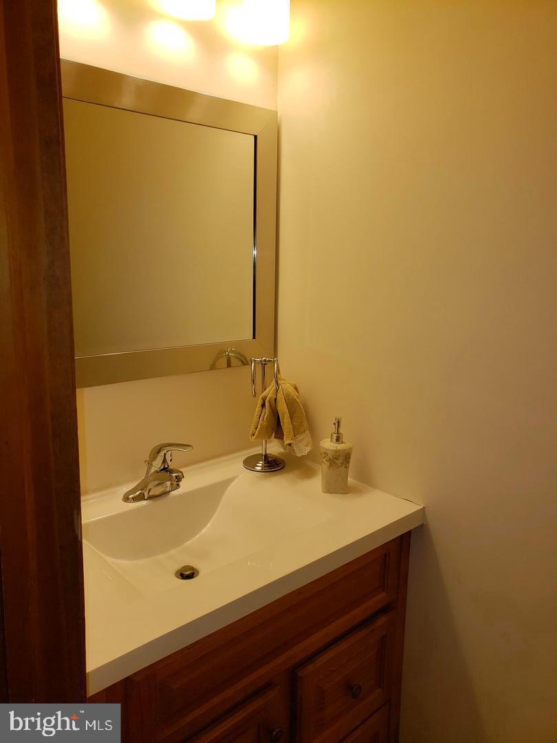 102 Gilbert Road Bordentown, NJ 08505 - Photo 18 of 28 a bathroom with a sink and a mirror