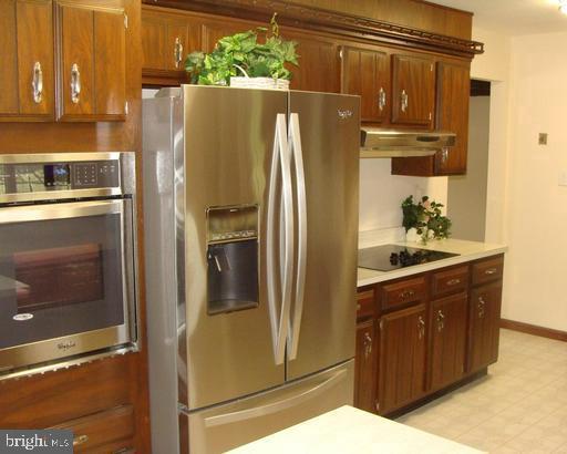 102 Gilbert Road Bordentown, NJ 08505 - Photo 3 of 28 a kitchen with stainless steel appliances granite countertop a refrigerator and a stove