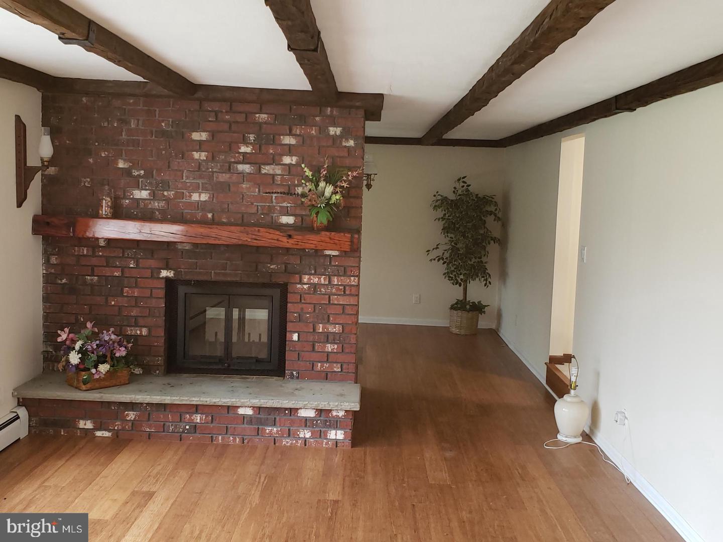 102 Gilbert Road Bordentown, NJ 08505 - Photo 8 of 28 a living room with a fireplace