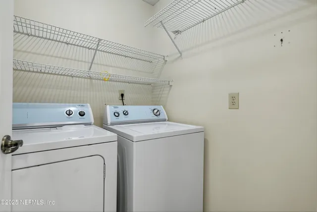 a view of a room with toys and ceiling fan