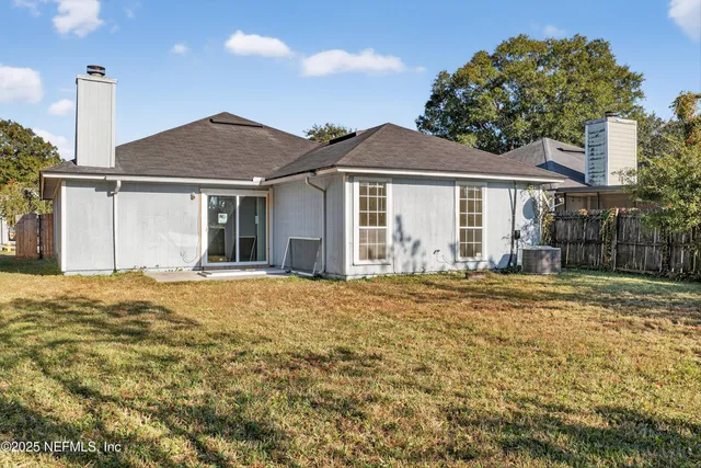 a house with yard in front of it