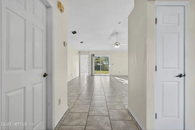 a view of an entryway with wooden floor
