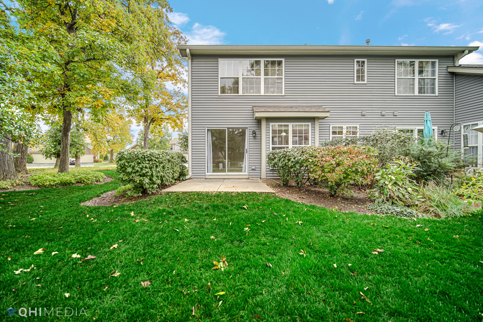 1123 Coldspring Road, Unit 1123 Elgin, IL 60120 - Photo 2 of 23 a front view of a house with garden