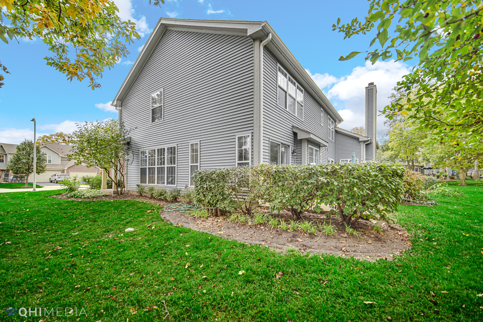 1123 Coldspring Road, Unit 1123 Elgin, IL 60120 - Photo 22 of 23 a front view of a house with a yard