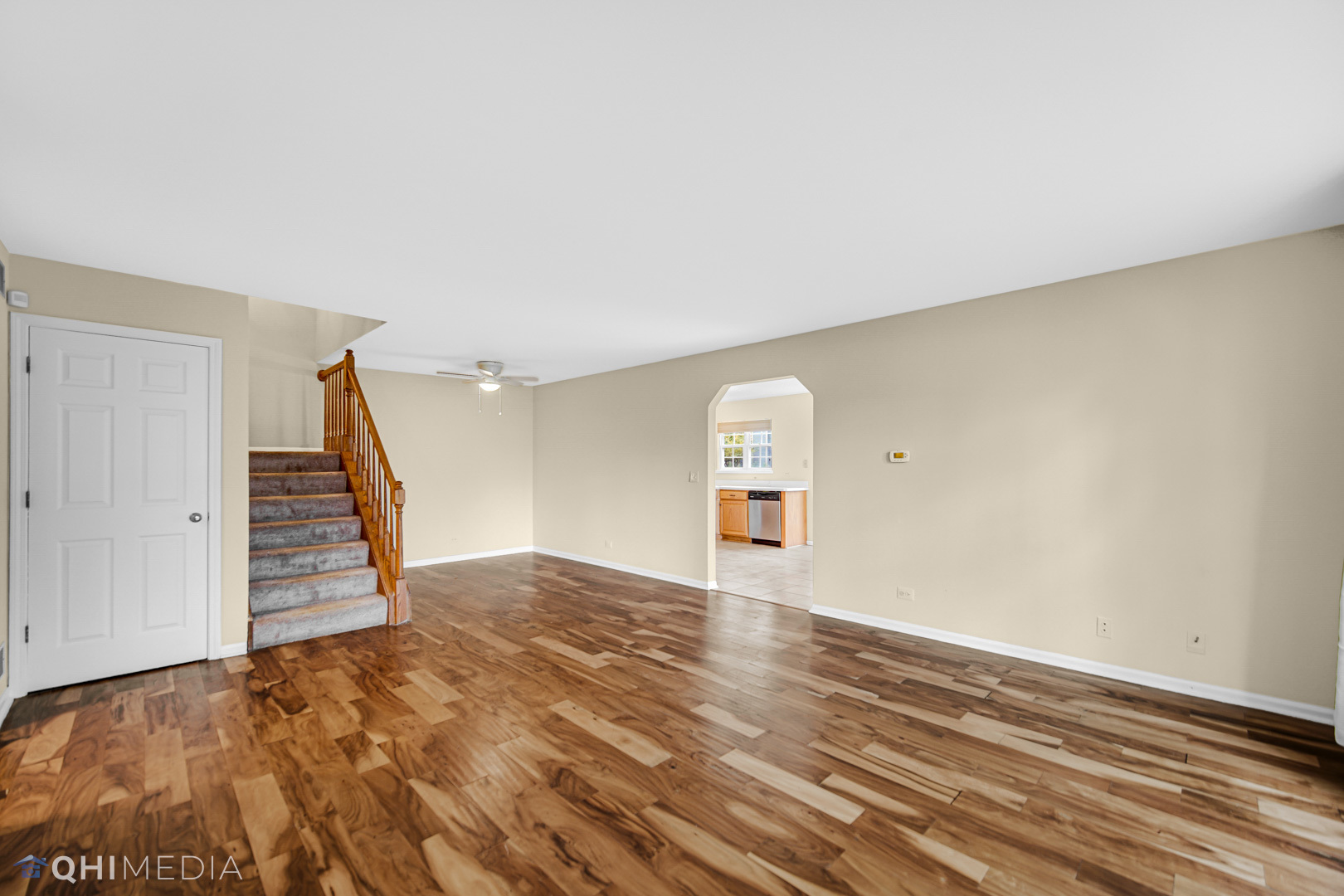 1123 Coldspring Road, Unit 1123 Elgin, IL 60120 - Photo 3 of 23 a view of an empty room with wooden floor and stairs