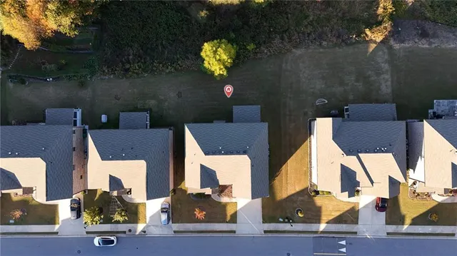an aerial view of a house with outdoor space