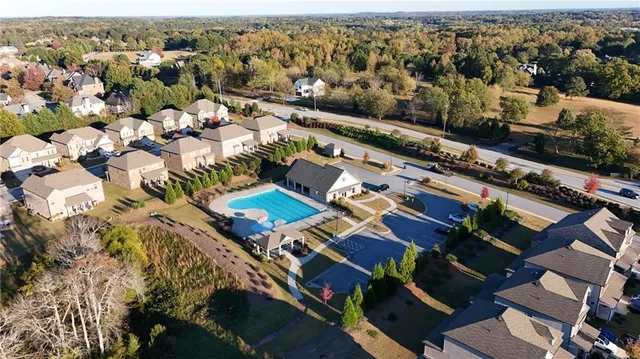 an aerial view of residential building with parking