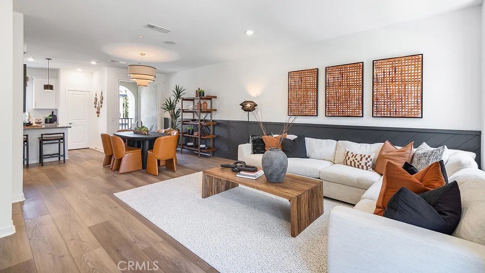 8421 Tapia Way Rancho Cucamonga, CA 91730 - Photo 1 of 24 a living room with furniture and wooden floor
