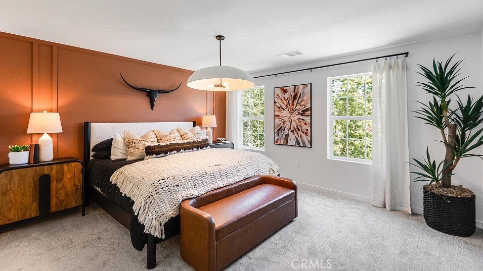 8421 Tapia Way Rancho Cucamonga, CA 91730 - Photo 9 of 24 a spacious bedroom with a bed and a potted plant