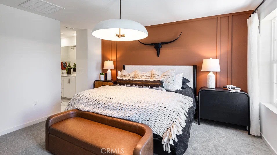 8421 Tapia Way Rancho Cucamonga, CA 91730 - Photo 10 of 24 a bedroom with a bed and a chandelier