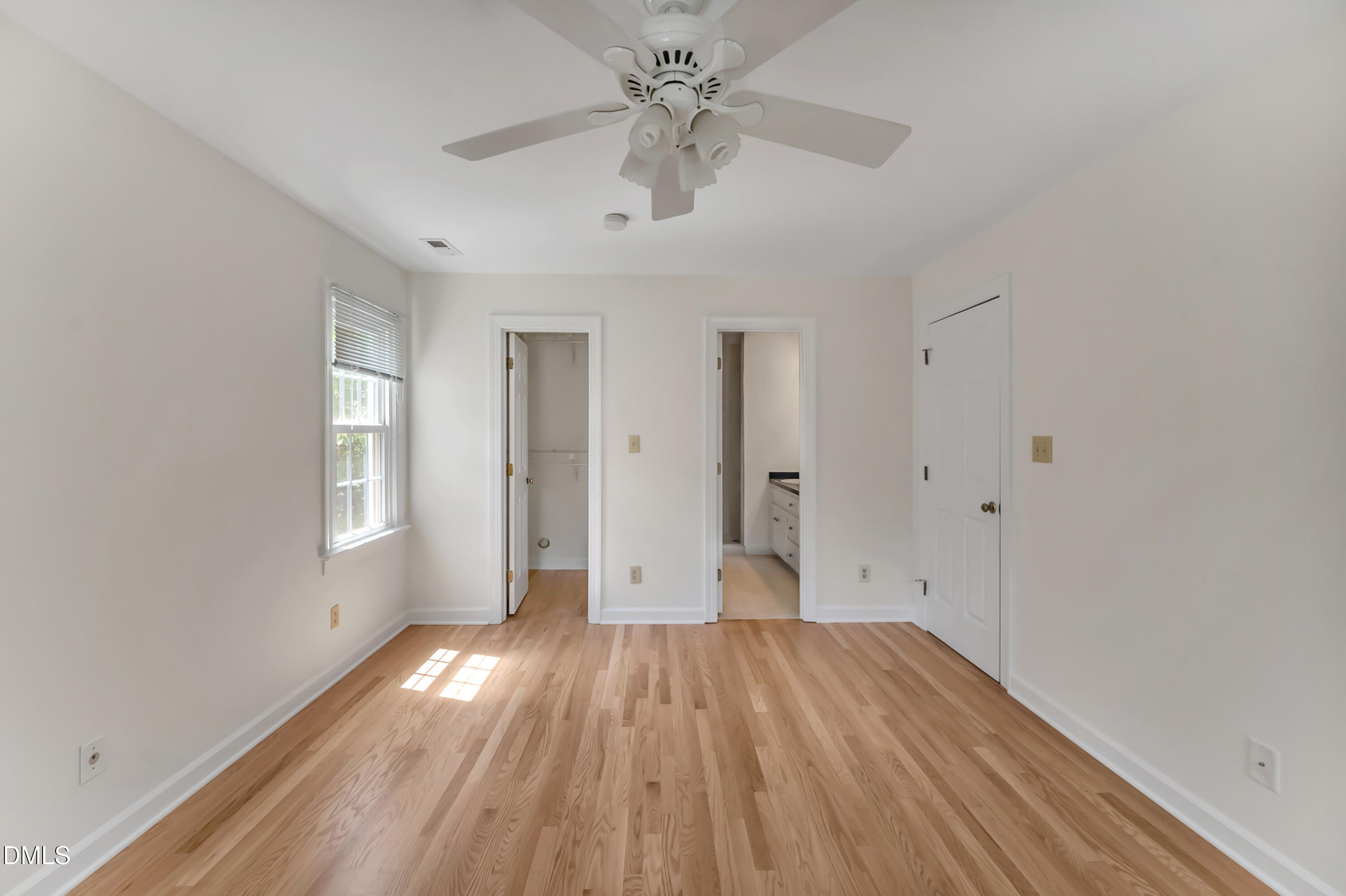 7500 Drayton Court Raleigh, NC 27615 - Photo 12 of 27 a view of empty room with wooden floor and fan