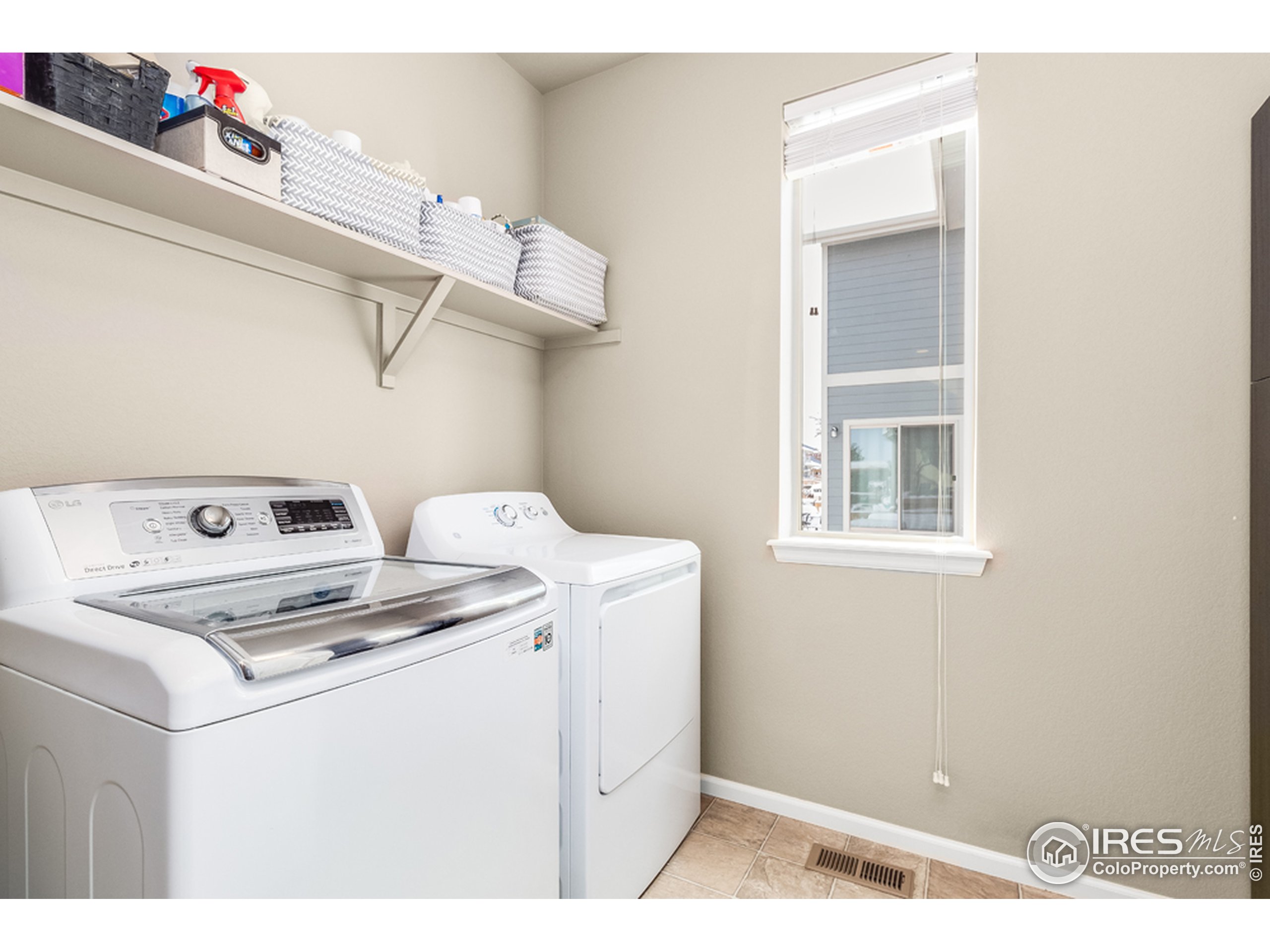6559 Tombstone Ridge Road Timnath, CO 80547 - Photo 11 of 30 a utility room with dryer and washer