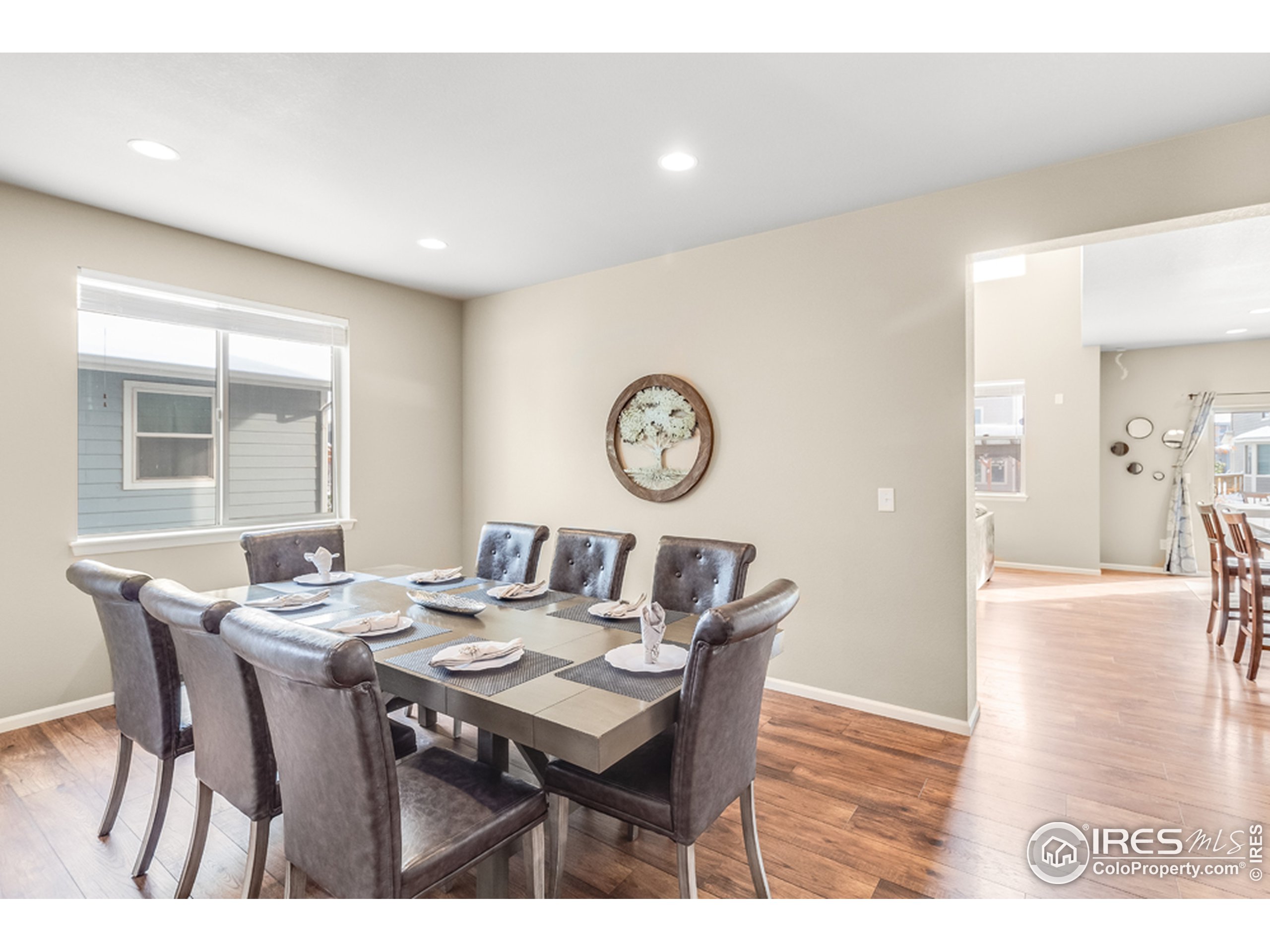 6559 Tombstone Ridge Road Timnath, CO 80547 - Photo 12 of 30 a view of a dining room with furniture and a table