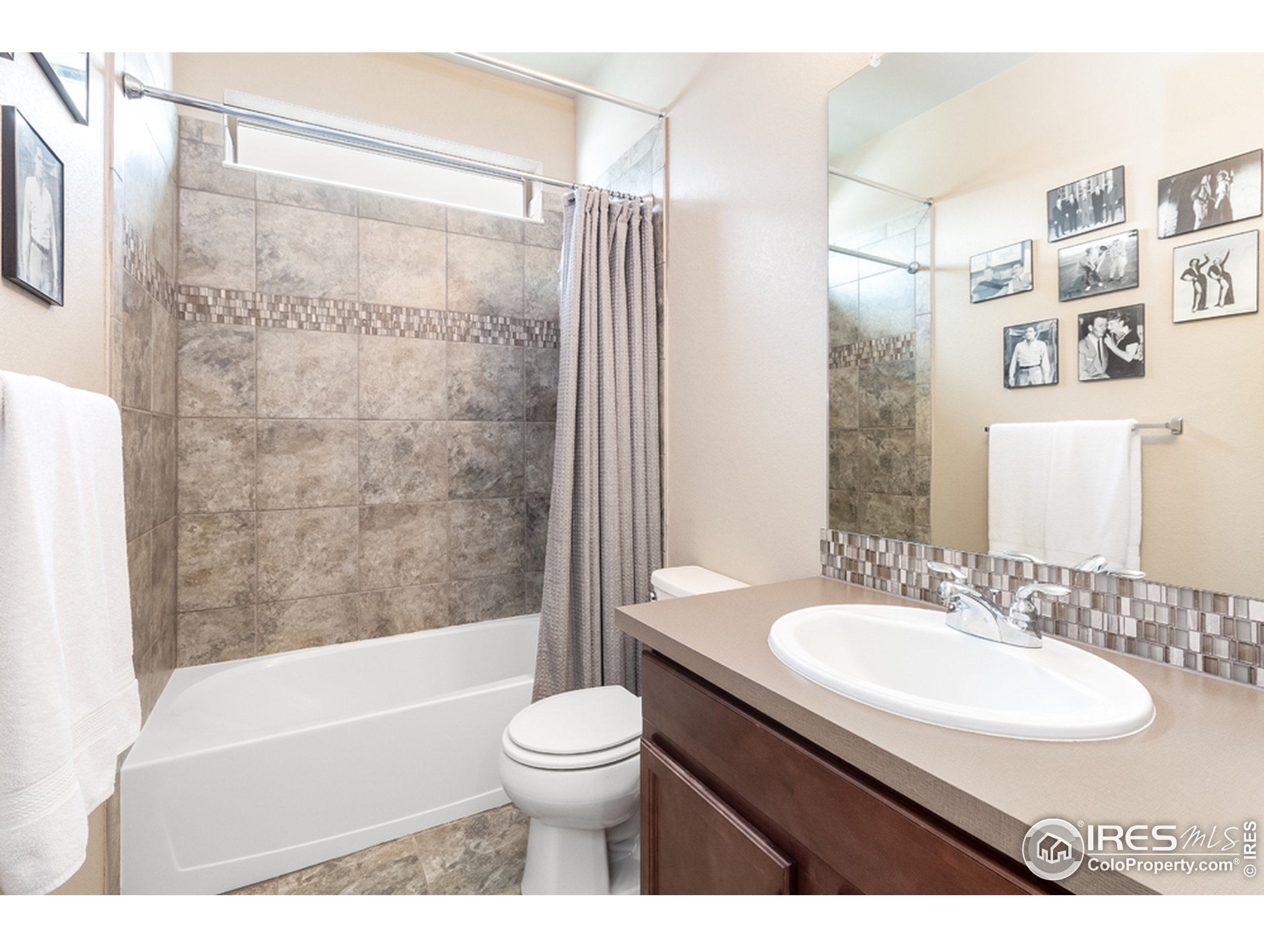 6559 Tombstone Ridge Road Timnath, CO 80547 - Photo 13 of 30 a bathroom with a sink toilet and shower